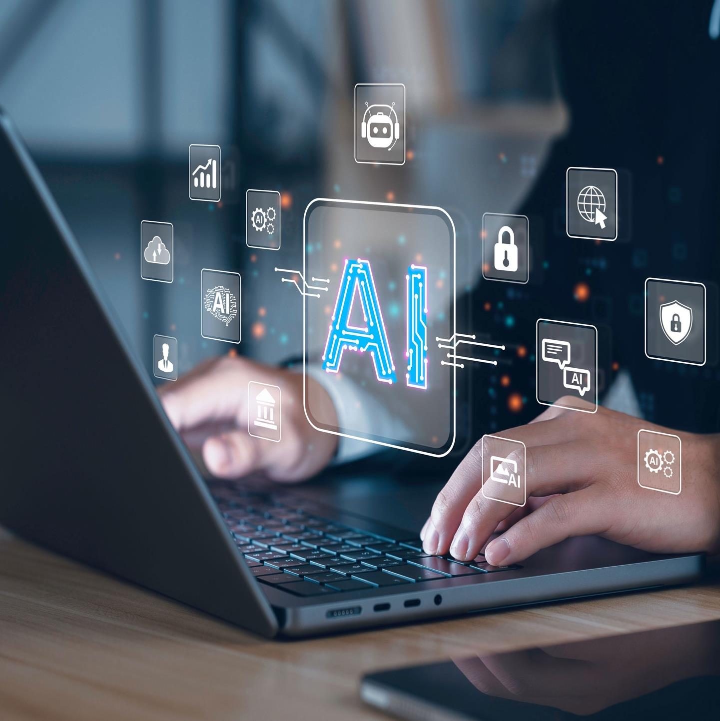 Hands on a laptop with AI and security icons