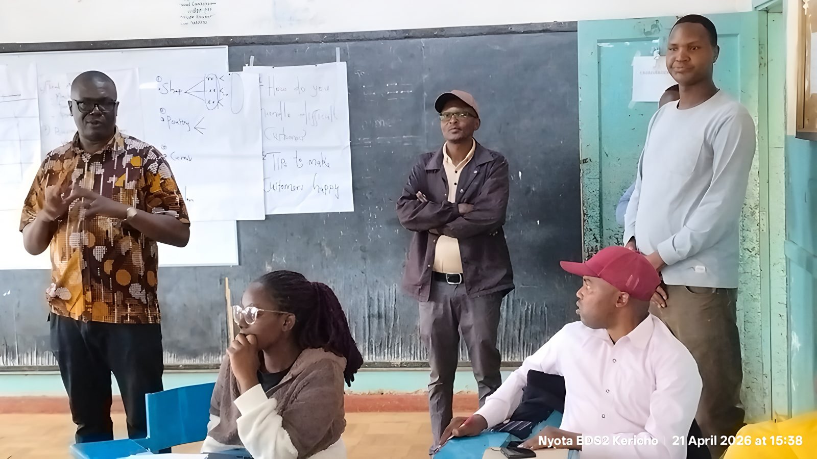 A facilitator addressing a BDS classroom in Kericho